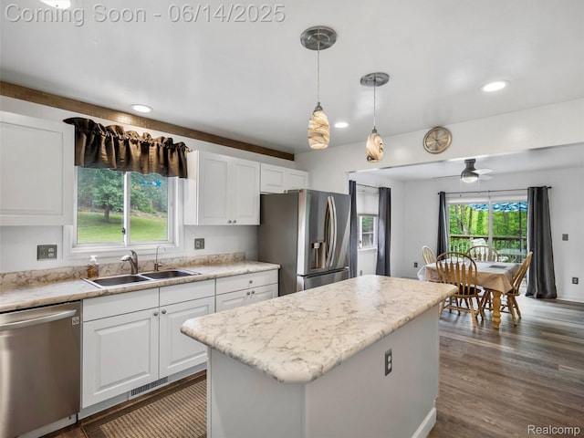 4960 Paula Ave, Clarkston, MI 48346 - kitchen featuring stainless steel appliances, white cabinetry, a ceiling fan, a center island, and recessed lighting