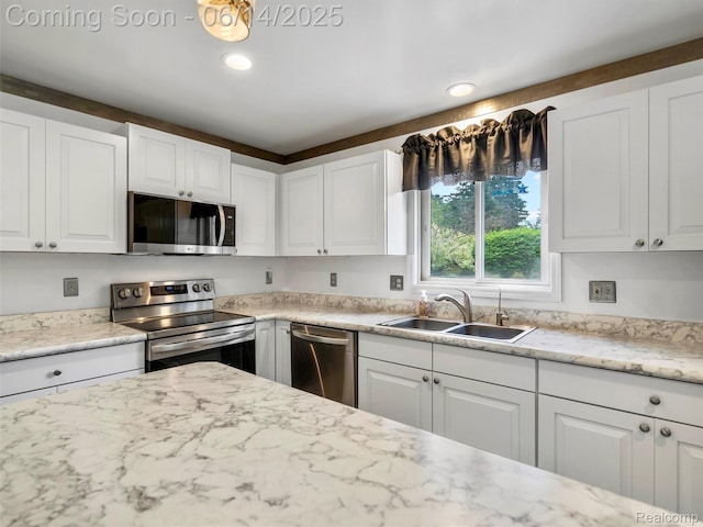 4960 Paula Ave, Clarkston, MI 48346 - kitchen featuring stainless steel appliances, white cabinetry, recessed lighting, and light stone countertops