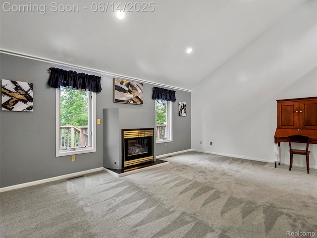 4960 Paula Ave, Clarkston, MI 48346 - unfurnished living room featuring carpet flooring, a glass covered fireplace, recessed lighting, and high vaulted ceiling