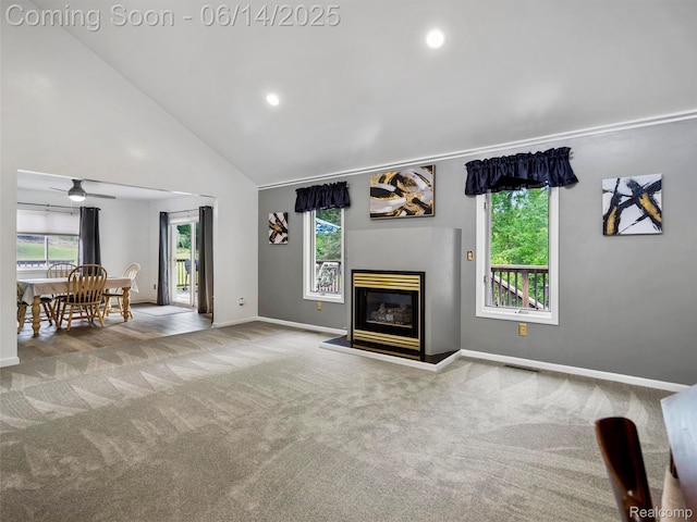 4960 Paula Ave, Clarkston, MI 48346 - carpeted living area featuring a ceiling fan, a glass covered fireplace, recessed lighting, and high vaulted ceiling