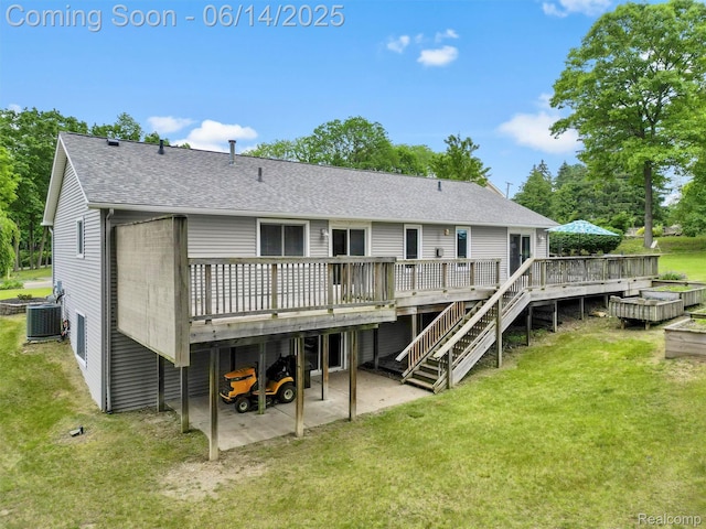 4960 Paula Ave, Clarkston, MI 48346 - back of property featuring a patio area, a deck, a yard, and a shingled roof