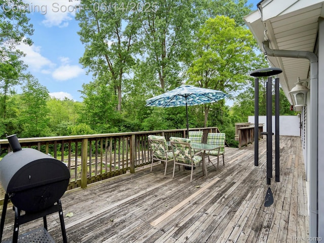4960 Paula Ave, Clarkston, MI 48346 - wooden deck with outdoor dining space and area for grilling