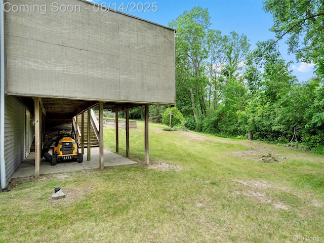 4960 Paula Ave, Clarkston, MI 48346 - view of grassy yard featuring stairway