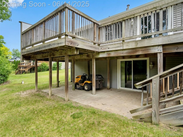 4960 Paula Ave, Clarkston, MI 48346 - back of property featuring a lawn, a deck, and a patio area