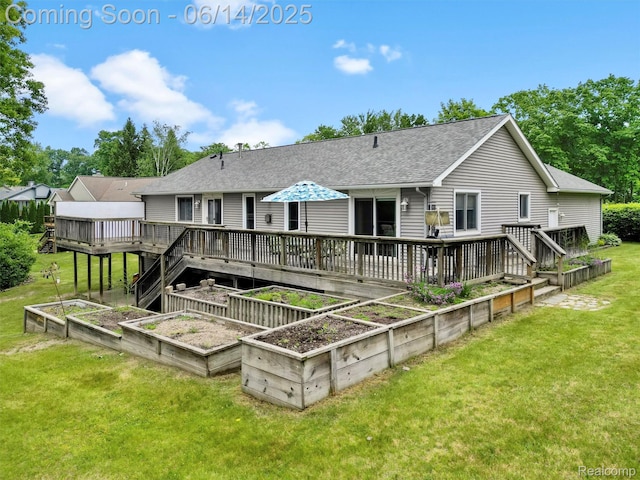 4960 Paula Ave, Clarkston, MI 48346 - back of house featuring a vegetable garden, roof with shingles, a yard, and a deck