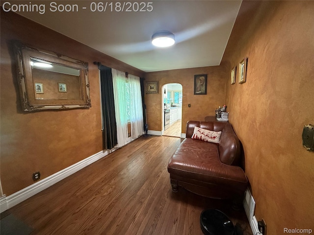 6715 Elizabeth Lake Rd, Waterford, MI 48327 - living area with arched walkways and wood finished floors