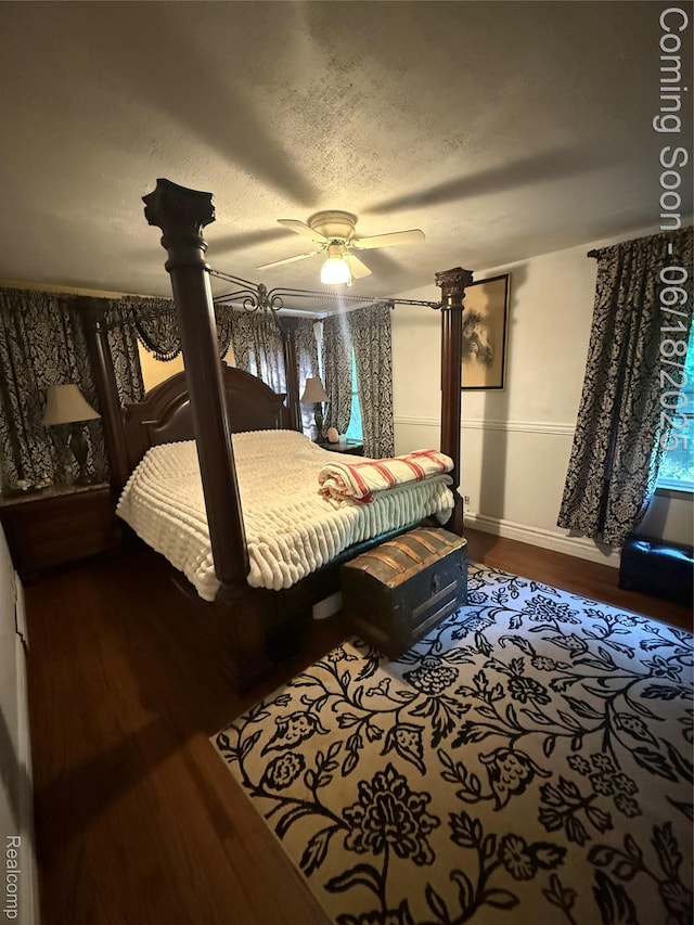 6715 Elizabeth Lake Rd, Waterford, MI 48327 - bedroom with dark wood finished floors and a ceiling fan