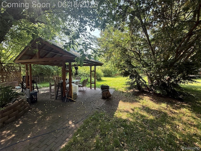 6715 Elizabeth Lake Rd, Waterford, MI 48327 - view of green lawn with a gazebo and a patio