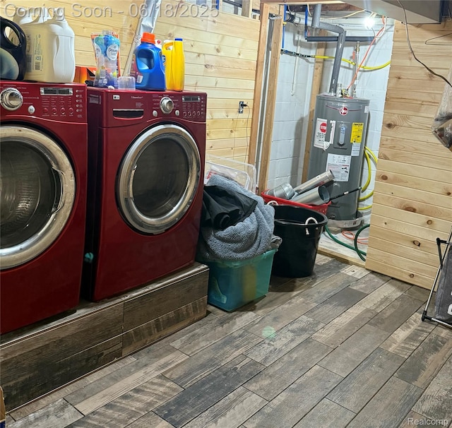 6715 Elizabeth Lake Rd, Waterford, MI 48327 - laundry area featuring washer and clothes dryer, wood finished floors, water heater, and wood walls