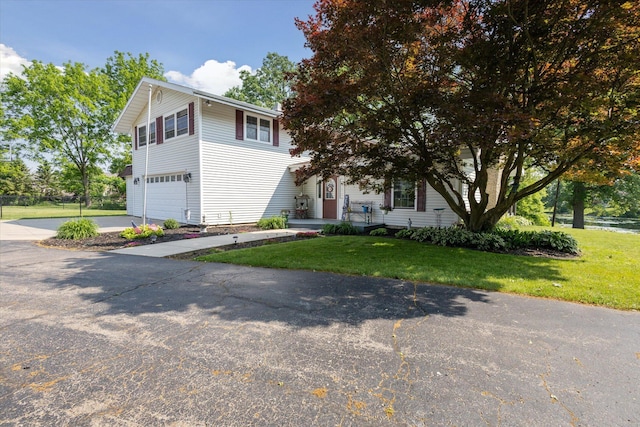 14747 A Dr N, Marshall, MI 49068 - view of front of house featuring an attached garage, driveway, and a front yard