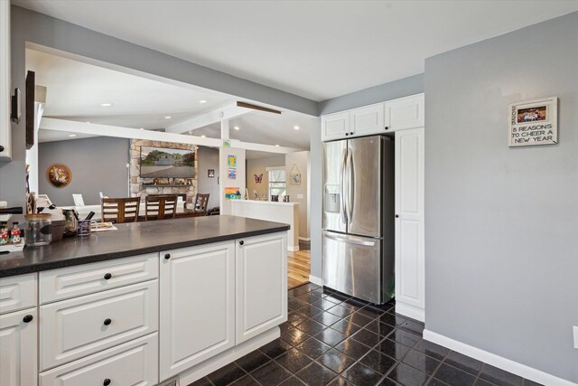 14747 A Dr N, Marshall, MI 49068 - kitchen featuring stainless steel fridge with ice dispenser, dark countertops, white cabinetry, a peninsula, and recessed lighting