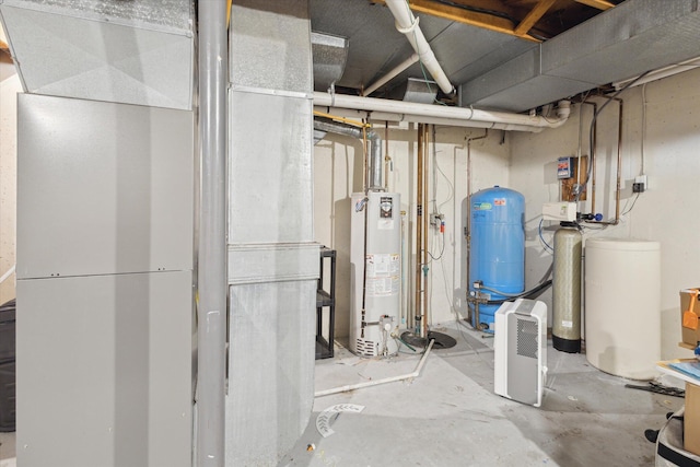 14747 A Dr N, Marshall, MI 49068 - unfinished below grade area featuring a water pressure tank, a water softener, and gas water heater
