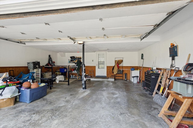 14747 A Dr N, Marshall, MI 49068 - garage with wood walls and a wainscoted wall