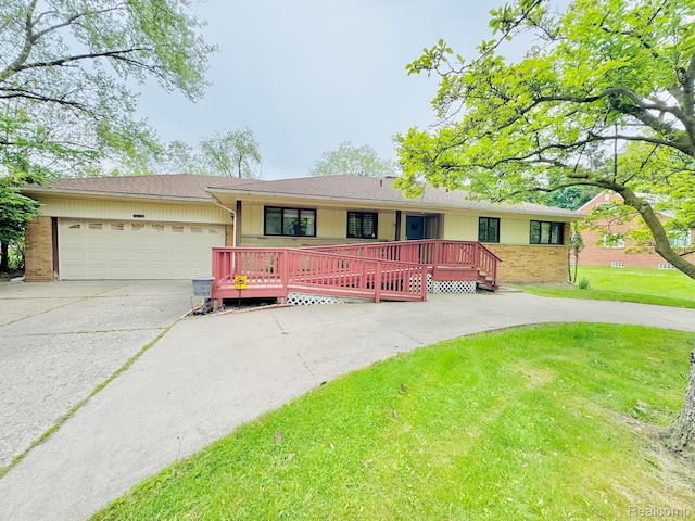 24230 Berg Rd, Commerce Twp, MI 48033 - ranch-style house featuring driveway, a garage, a front lawn, brick siding, and a porch