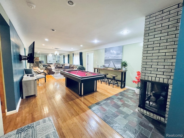 24230 Berg Rd, Commerce Twp, MI 48033 - rec room featuring pool table, wood finished floors, a brick fireplace, and recessed lighting