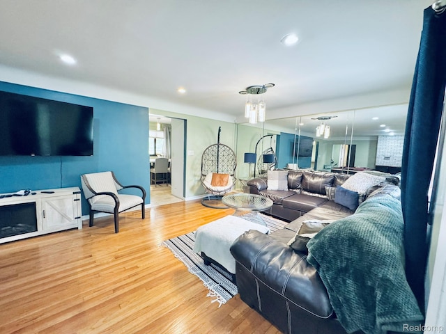 24230 Berg Rd, Commerce Twp, MI 48033 - living room featuring wood finished floors and recessed lighting