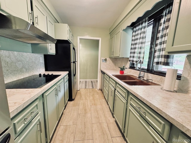 24230 Berg Rd, Commerce Twp, MI 48033 - kitchen with green cabinets, black electric cooktop, and under cabinet range hood
