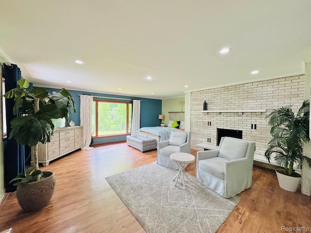 24230 Berg Rd, Commerce Twp, MI 48033 - living room featuring crown molding, wood finished floors, a fireplace, and recessed lighting