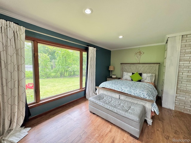 24230 Berg Rd, Commerce Twp, MI 48033 - bedroom with wood finished floors, crown molding, and recessed lighting