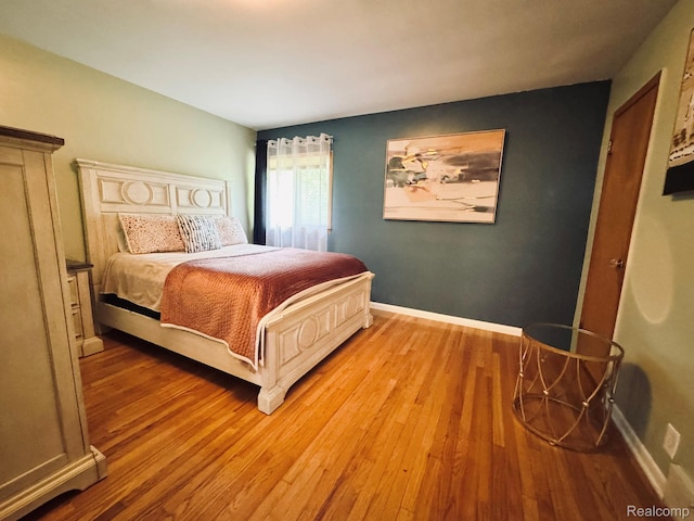 24230 Berg Rd, Commerce Twp, MI 48033 - bedroom with wood finished floors and baseboards