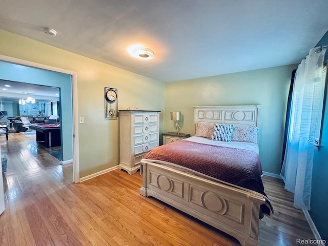 24230 Berg Rd, Commerce Twp, MI 48033 - bedroom featuring baseboards and light wood-style flooring