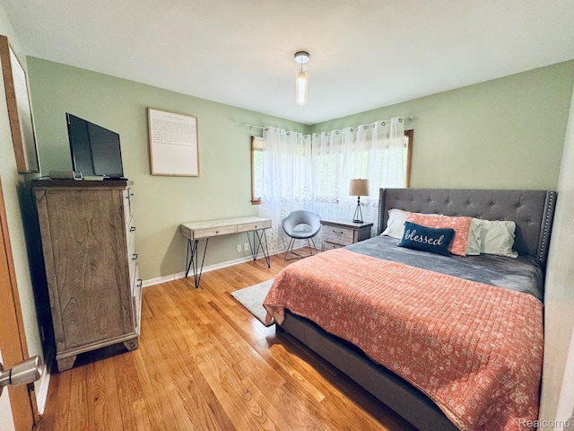 24230 Berg Rd, Commerce Twp, MI 48033 - bedroom featuring light wood-style flooring and baseboards