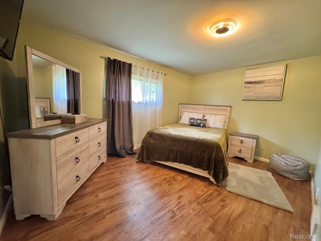24230 Berg Rd, Commerce Twp, MI 48033 - bedroom with wood finished floors and baseboards