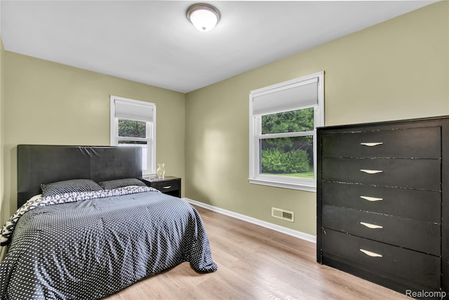24710 Lathrup Blvd, Southfield, MI 48075 - bedroom with light wood finished floors and baseboards