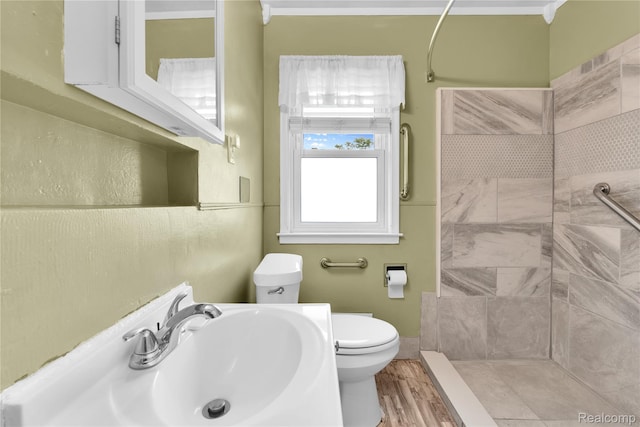 24710 Lathrup Blvd, Southfield, MI 48075 - bathroom with tiled shower and wood finished floors
