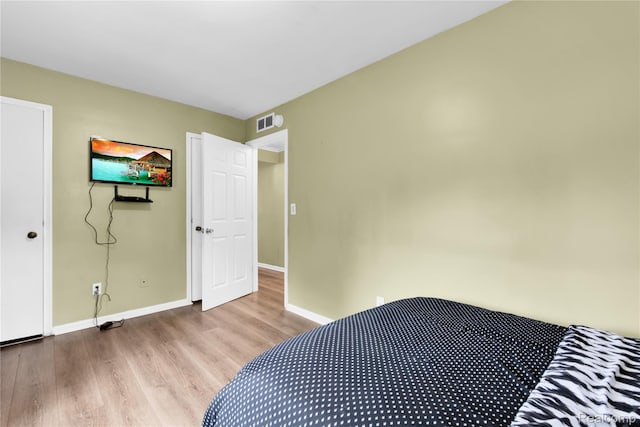 24710 Lathrup Blvd, Southfield, MI 48075 - bedroom with wood finished floors and baseboards