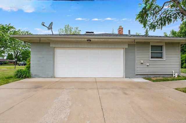 24710 Lathrup Blvd, Southfield, MI 48075 - garage featuring concrete driveway