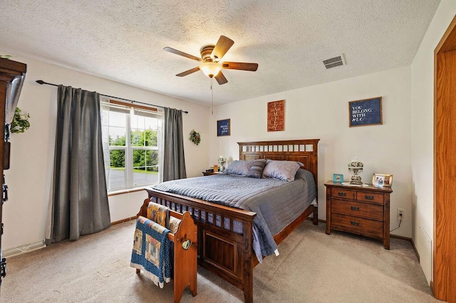 66291 M-62, Edwardsburg, MI 49112 - bedroom with light colored carpet, a textured ceiling, and a ceiling fan