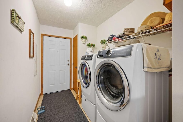 66291 M-62, Edwardsburg, MI 49112 - washroom with washer and dryer, carpet flooring, and a textured ceiling