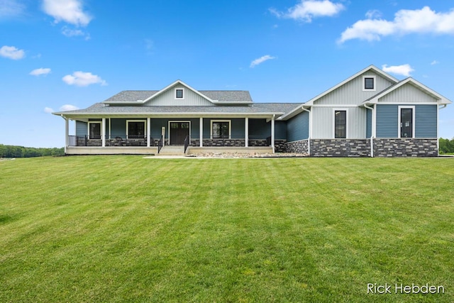 1153 S Edgar Rd, Mason, MI 48854 - view of front facade with a front lawn, stone siding, and covered porch