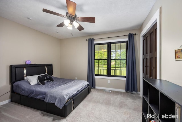 1153 S Edgar Rd, Mason, MI 48854 - carpeted bedroom with baseboards and ceiling fan