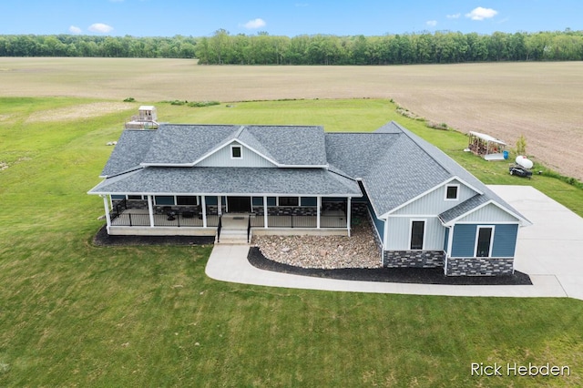 1153 S Edgar Rd, Mason, MI 48854 - view of front of house with a shingled roof, a front lawn, and a view of countryside