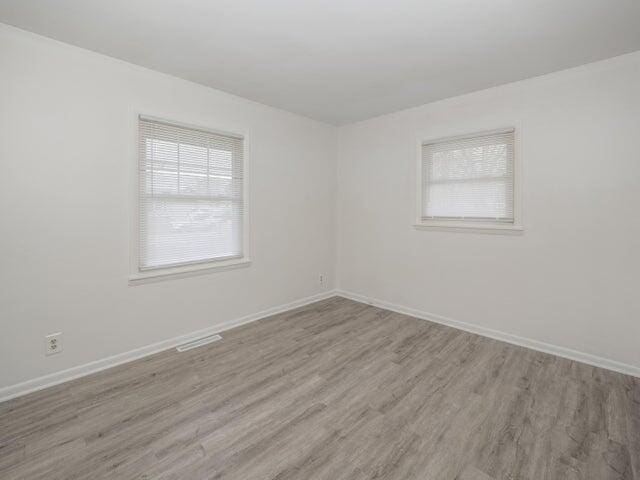 1314 Magnolia St, Kalamazoo, MI 49048 - unfurnished room featuring light wood-style floors and baseboards