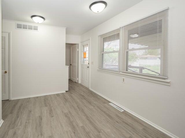 1314 Magnolia St, Kalamazoo, MI 49048 - spare room featuring wood finished floors and baseboards