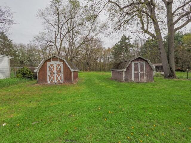1516 Nazareth Rd, Kalamazoo, MI 49048 - view of green lawn featuring a storage unit