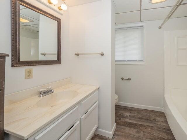 1516 Nazareth Rd, Kalamazoo, MI 49048 - bathroom featuring vanity, wood finished floors, and  shower combination