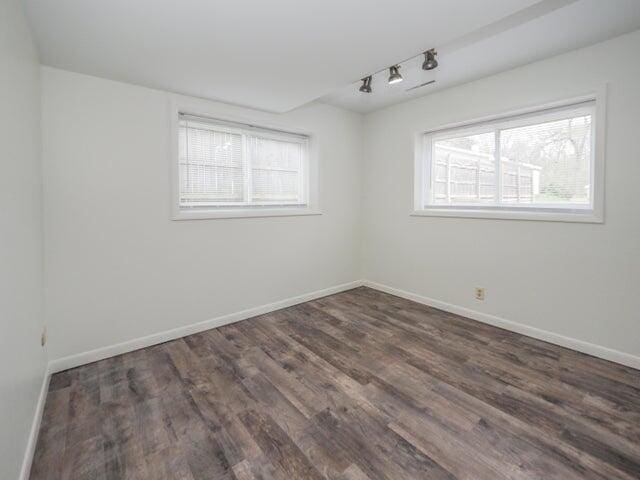 1516 Nazareth Rd, Kalamazoo, MI 49048 - empty room with track lighting, healthy amount of natural light, and wood finished floors