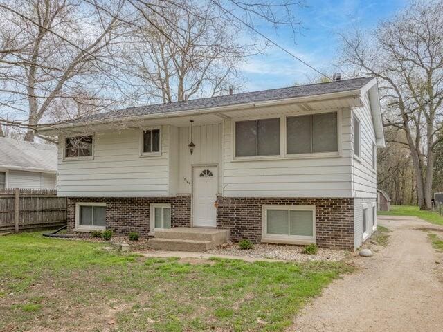1516 Nazareth Rd, Kalamazoo, MI 49048 - raised ranch featuring driveway and brick siding