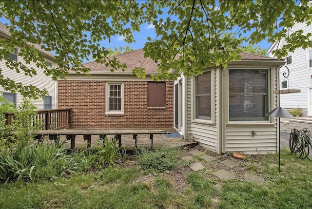 1307 Edgewood Ave, Ann Arbor, MI 48103 - rear view of property with brick siding, roof with shingles, and a wooden deck