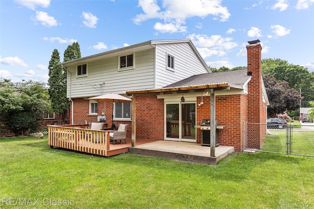 1915 Treadwell St, Westland, MI 48186 - rear view of house featuring brick siding, a chimney, a deck, and a gate