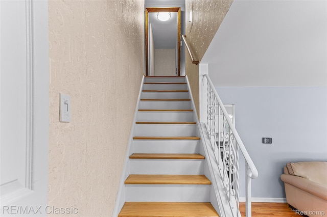 1915 Treadwell St, Westland, MI 48186 - stairway featuring a textured wall and wood finished floors