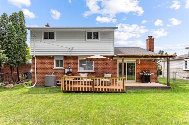 1915 Treadwell St, Westland, MI 48186 - rear view of house featuring brick siding, a deck, and a chimney