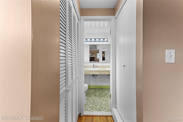 1915 Treadwell St, Westland, MI 48186 - hallway featuring wood finished floors and a sink