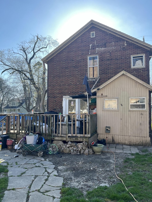 928 Trimble Ave, Kalamazoo, MI 49048 - back of property with a deck and brick siding