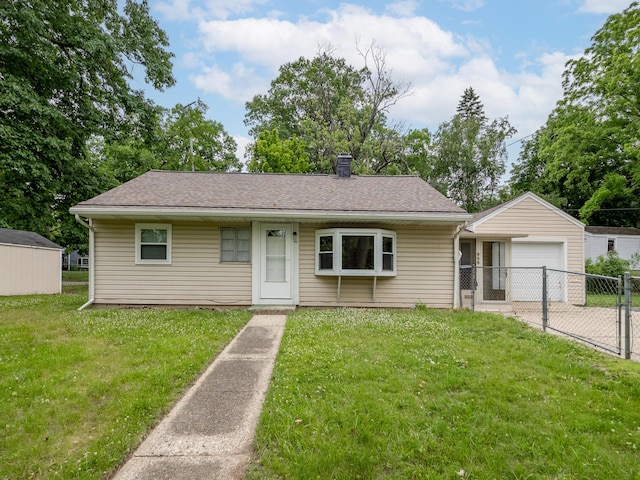 909 Royce Ave, Kalamazoo, MI 49001 - bungalow with an outbuilding, roof with shingles, concrete driveway, and a chimney
