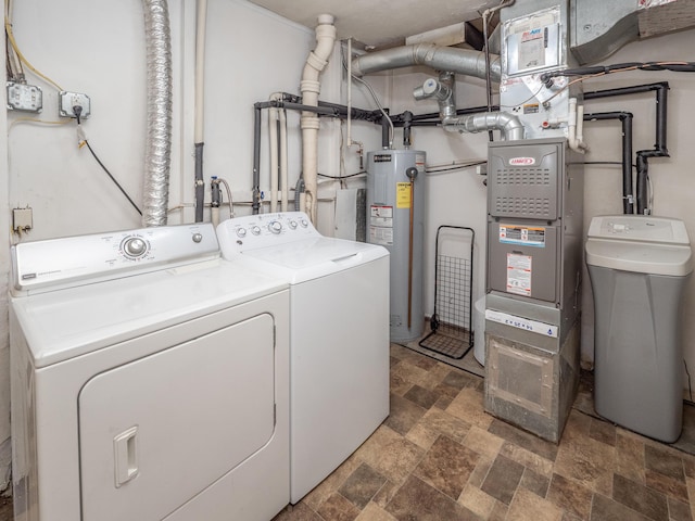 909 Royce Ave, Kalamazoo, MI 49001 - laundry area with water heater, washing machine and dryer, and stone finish floors